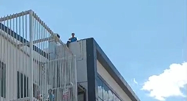 Urfa'da işten çıkarılan işçi fabrikanın çatısına çıktı